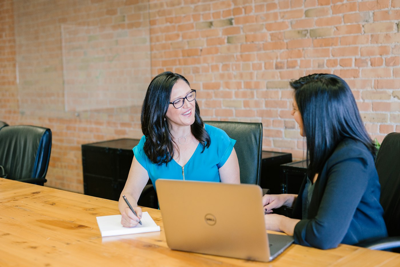Finance leaders meeting in a professional office setting